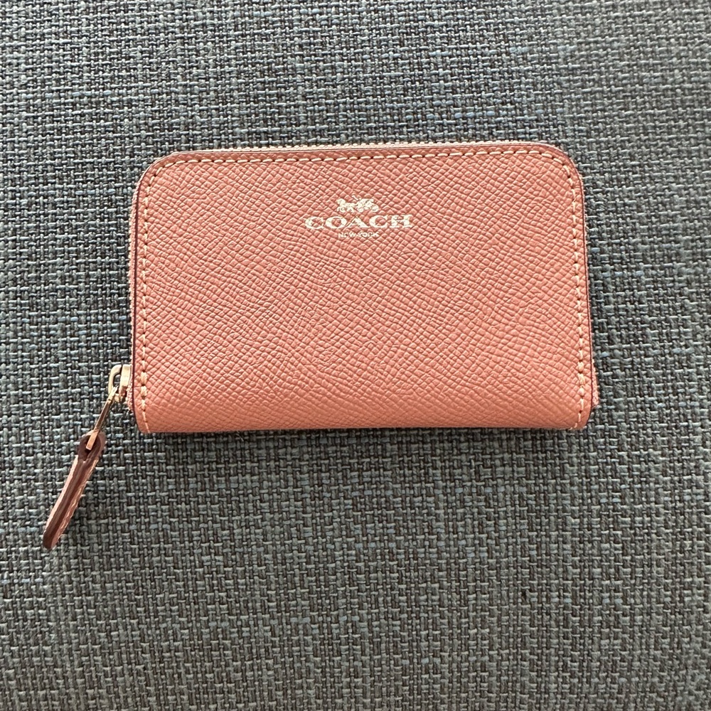 Never worn with tags Coach Small Zip Wallet
Around Card Case in Dusty Rose.